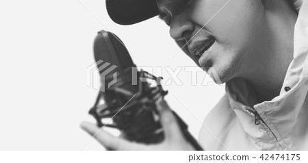 asian male singer singing with microphone asian male singer singing with microphone 42474175