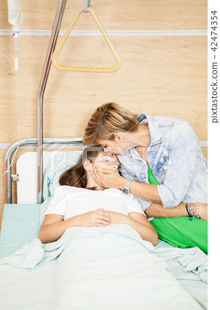 Mother taking care of her daughter  42474354