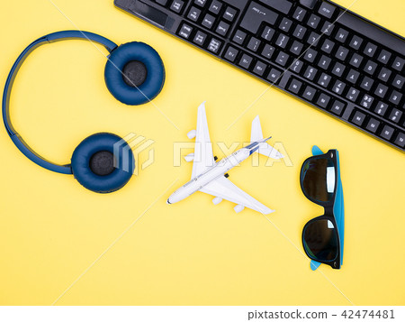 Flat lay top view of a plane on yellow backgrond Flat lay top view of a plane on yellow backgrond 42474481