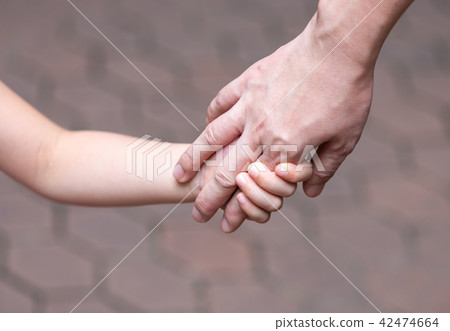 Holding hand, mother and daughter 42474664