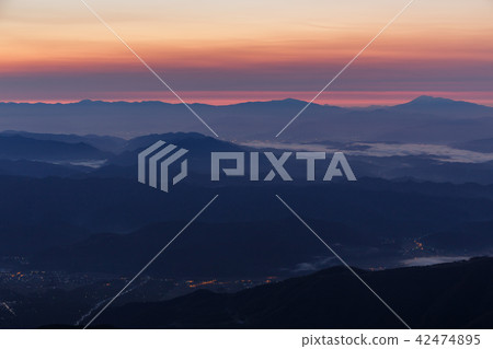 Morning glow and mountain ranges stained red 42474895