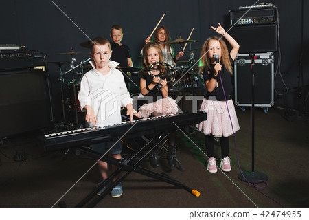 happy children singing and playing music happy children singing and playing music 42474955
