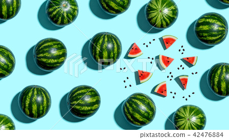 Whole and sliced watermelons 42476884