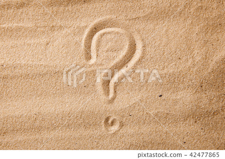 The question mark is sand painted on sand The question mark is sand painted on sand 42477865