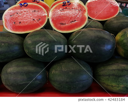 Pile watermelon on display for sale 42483184