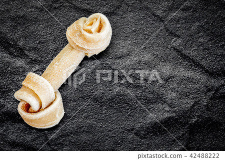 Dog bone on black backgroung 42488222