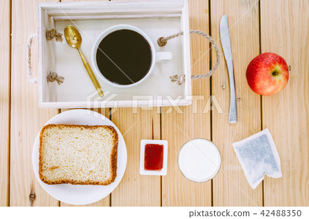 Breakfast set on wooden table 42488350