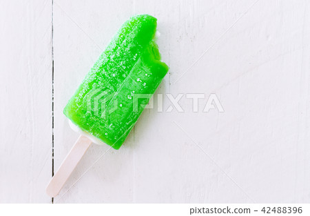 Bite Ice cream lemon on wooden background Bite Ice cream lemon on wooden background 42488396