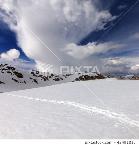 Snowy mountains and sky with clouds Snowy mountains and sky with clouds 42491813