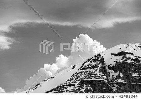 Black and white snowy rocks and clouds Black and white snowy rocks and clouds 42491844