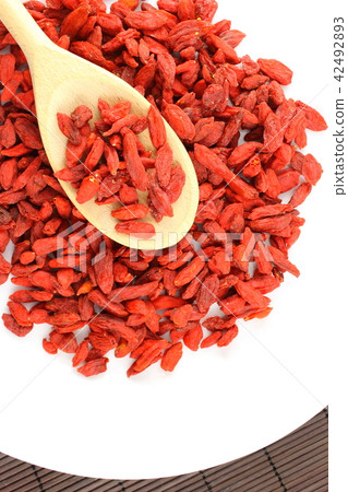 dried goji berries on a wooden spoon dried goji berries on a wooden spoon 42492893