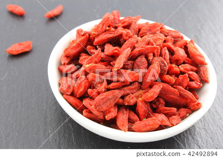 dried goji berries in a small white bowl 42492894