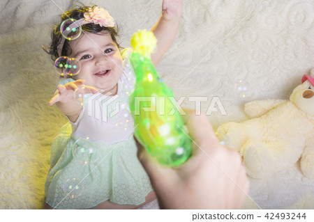 Little girl enjoying from fired soap bubbles from Little girl enjoying from fired soap bubbles from 42493244