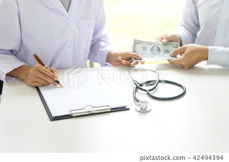 Business man or patient give bribe to the docto Business man or patient give bribe to the docto 42494394