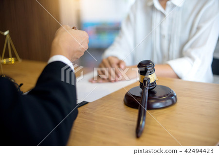 lawyer or  judge work in the office with gavel 42494423