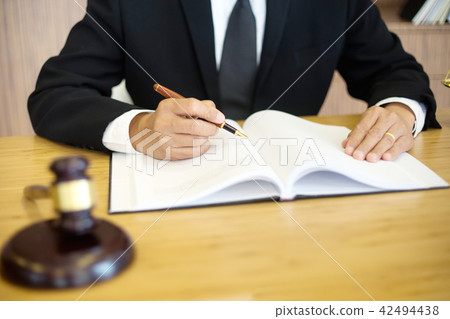 lawyer or  judge work in the office with gavel 42494438