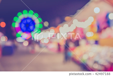 blur theme park on night time. 42497188