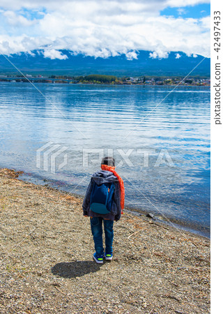 japanese boy walking in Kogamasao Park japanese boy walking in Kogamasao Park 42497433