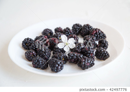 Fresh berries on white concrete background Fresh berries on white concrete background 42497776