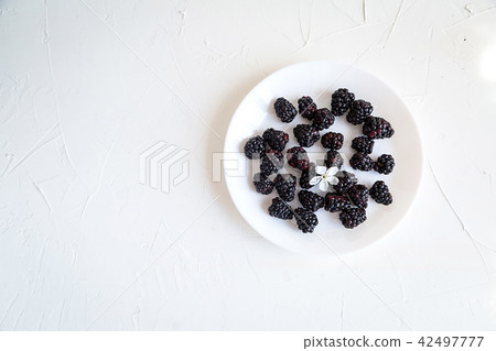 Fresh berries on white concrete background Fresh berries on white concrete background 42497777