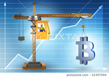 Construction crane lifting bitcoin in cryptocurrency concept 42497994