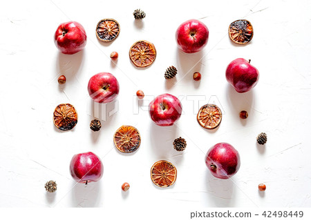 Flat lay of red fresh apples on white concrete background Flat lay of red fresh apples on white concrete background 42498449