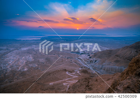 Beautiful sunrise over Masada fortress 42500309