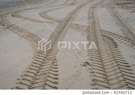 car wheel tracks on beach sand car wheel tracks on beach sand 42500713