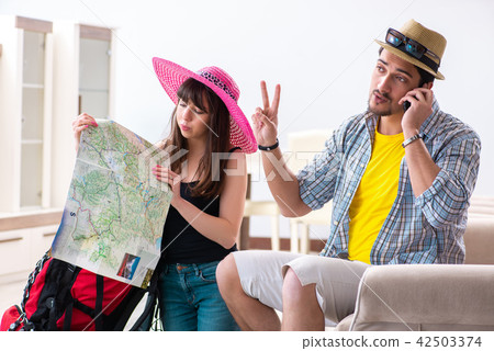 Young pair planning their honeymoon camping trip Young pair planning their honeymoon camping trip 42503374
