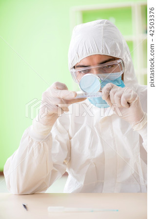 Chemist working in the lab on new experiment Chemist working in the lab on new experiment 42503376
