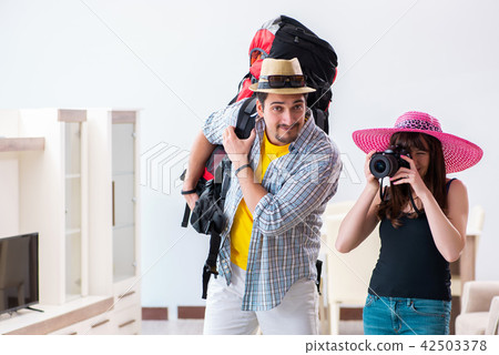 Young active pair preparing for honeymoon trip Young active pair preparing for honeymoon trip 42503378