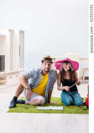 Young pair planning their honeymoon camping trip 42503391