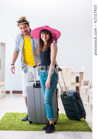 Young family packing for vacation travel Young family packing for vacation travel 42503485