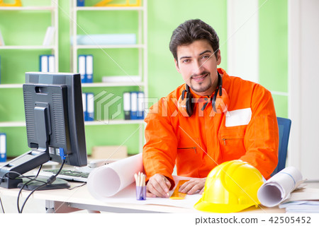 Construction supervisor planning new project in office Construction supervisor planning new project in office 42505452