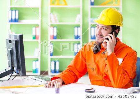 Construction supervisor planning new project in office Construction supervisor planning new project in office 42505455