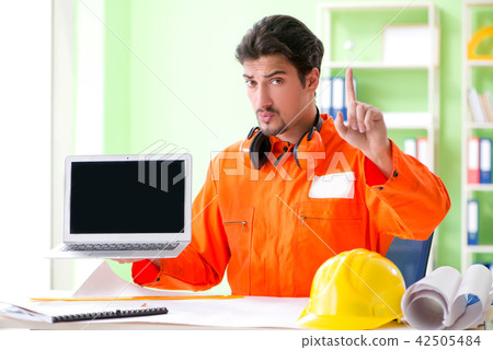Construction supervisor planning new project in office 42505484