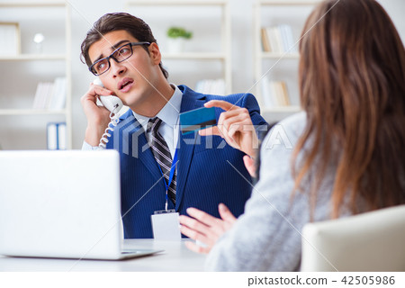 Woman makes payment with credit card  42505986