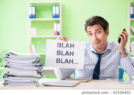 Businessman having problems with paperwork and workload Businessman having problems with paperwork and workload 42506402
