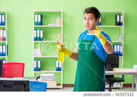 Male handsome professional cleaner working in the office Male handsome professional cleaner working in the office 42507312