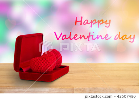 red heart in red box on wooden floor 42507480