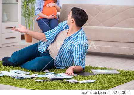 Young family in budget planning concept Young family in budget planning concept 42510661