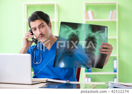 Young doctor working in the hospital Young doctor working in the hospital 42512274