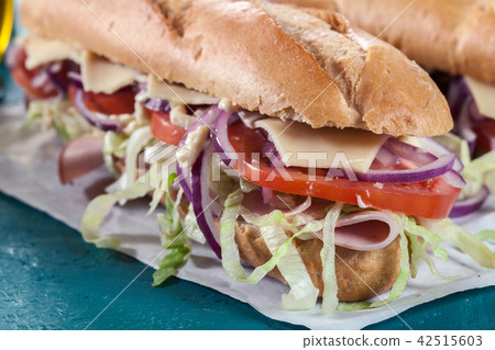 Submarine sandwiches with ham and other 42515603
