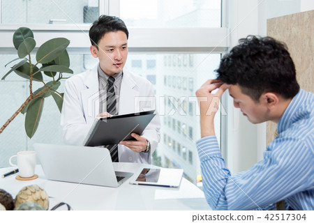 Doctors listening to symptoms of headache patients Doctors listening to symptoms of headache patients 42517304