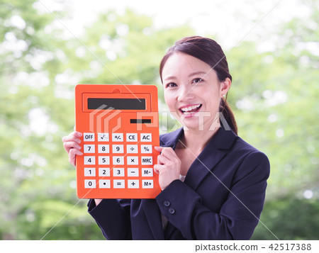 Business woman with Orange calculator 42517388
