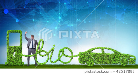Businessman with car powered with biofuel Businessman with car powered with biofuel 42517895