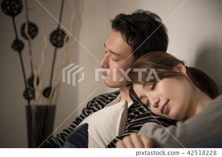 A couple sleeping closely together A couple sleeping closely together 42518228