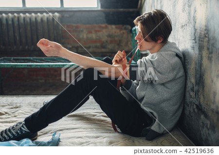 Man drug addict doing an injection dose in the arm Man drug addict doing an injection dose in the arm 42519636