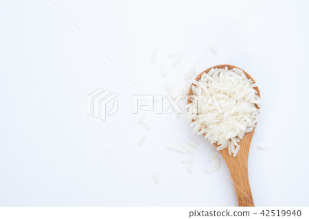 Jasmine rice on wooden spoon, isolated on white 42519940