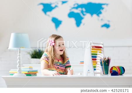 Child with abacus doing homework after school. 42520171